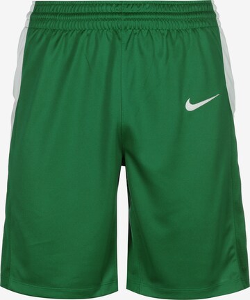 Loosefit Pantalon de sport NIKE en vert : devant