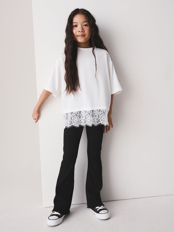 Next - Acampanado Leggings en negro