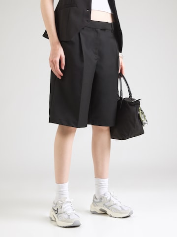 Monki Loose fit Pleat-front trousers in Black: front