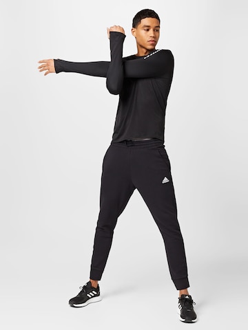 ADIDAS SPORTSWEAR Tapered Workout Pants 'Essentials French Terry' in Black