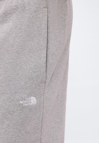 Tapered Pantaloni 'EVOLUTION SIMPLE DOME' di THE NORTH FACE in grigio