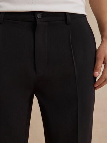 DAN FOX APPAREL Regular Pleat-Front Pants 'Toni' in Black