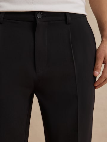 DAN FOX APPAREL Regular Pleat-Front Pants 'Toni' in Black