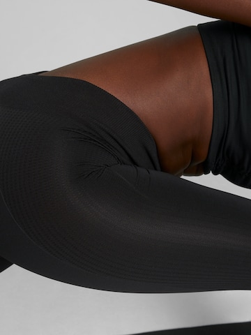 PUMA Skinny Spodnie sportowe 'Studio Foundation' w kolorze czarny