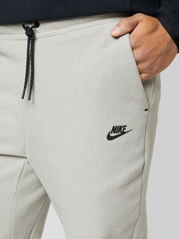 Nike Sportswear Tapered Trousers in Beige