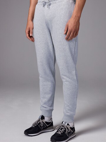 Next Tapered Trousers in Grey: front