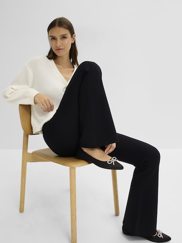 bonprix Levenevä Leggingsit värissä musta