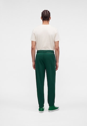 Tapered Pantaloni '1908' de la CONVERSE pe verde
