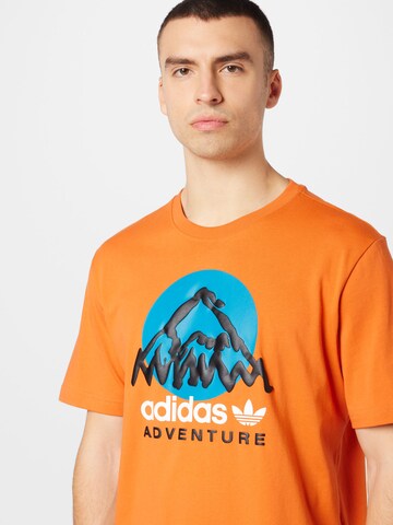 ADIDAS ORIGINALS - Camisa 'Adventure Mountain Front' em laranja