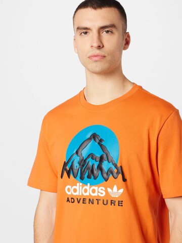 Tricou 'Adventure Mountain Front' de la ADIDAS ORIGINALS pe portocaliu