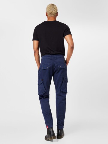 ALPHA INDUSTRIES - Tapered Calças cargo 'Combat' em azul