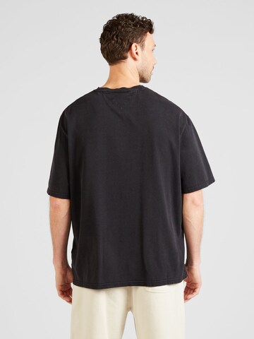 Tommy Jeans Koszulka 'VARSITY' w kolorze czarny