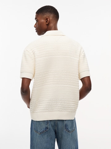 Tommy Jeans Neuletakki värissä beige