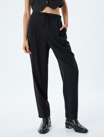 Koton Tapered Pleat-Front Pants in Black: front
