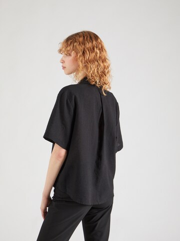 Monki - Blusa en negro