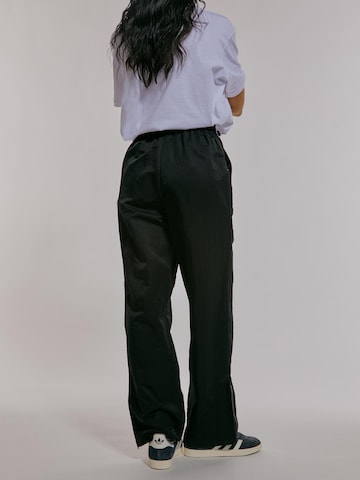 ABOUT YOU x Chiara Biasi Loose fit Pants 'Cleo' in Black