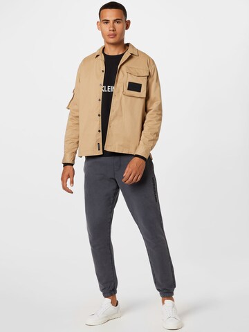 Calvin Klein Jeans Between-Season Jacket in Beige