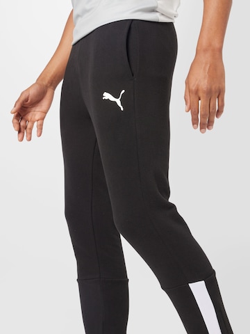 PUMATapered Sportske hlače - crna boja