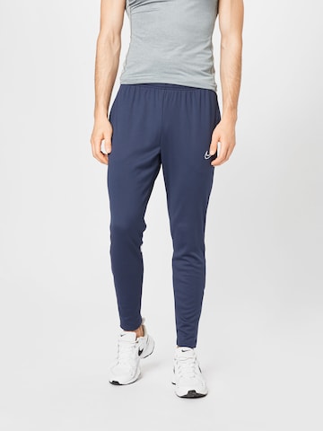 NIKE Slim fit Workout Pants in Blue: front