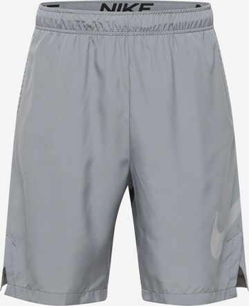 NIKE Workout Pants in Grey: front