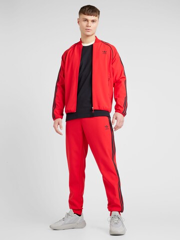 ADIDAS ORIGINALS Tapered Trousers in Red