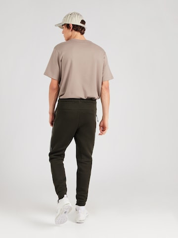 Effilé Pantalon Nike Sportswear en vert
