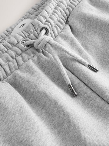 Loosefit Pantaloni di Next in grigio