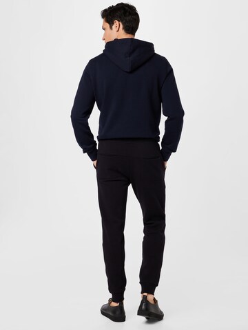 Tapered Pantaloni sportivi 'CENTRE' di BJÖRN BORG in nero