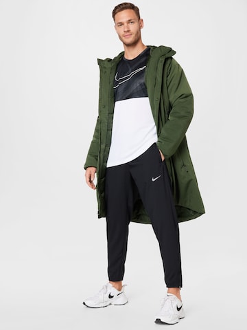 Tapered Pantaloni sport 'Challenger' de la NIKE pe negru