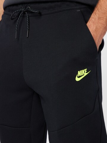 Nike Sportswear Дънки Tapered Leg Панталон в черно