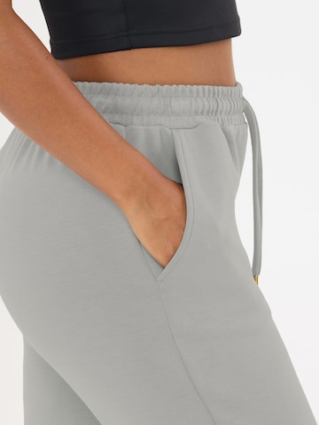 Athlecia Tapered Sportnadrágok 'Jacey V2' - szürke