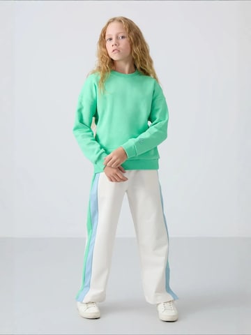 Tommy Life Bluzka sportowa 'TOMMY Jugend-Unisex-Sweatshirt Aus Baumwollmischung' w kolorze zielony