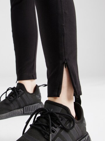 Champion Authentic Athletic Apparel - Skinny Leggings en negro