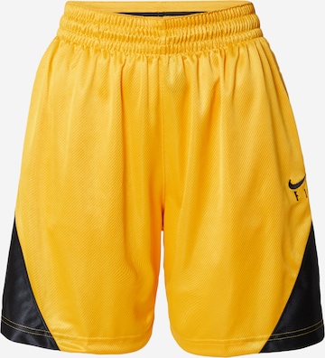 NIKE Workout Pants in Yellow: front
