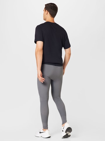 NIKE Skinny Sporthose in Grau