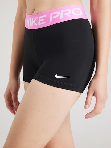 NIKE Skinny Športne hlače 'Pro' | črna barva