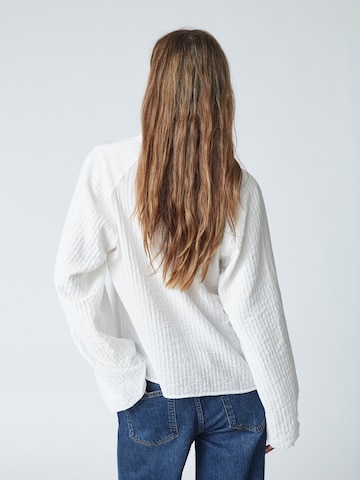 Chemisier 'Shina' co'couture en blanc
