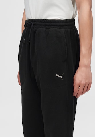 PUMA Loose fit Trousers 'Essential' in Black