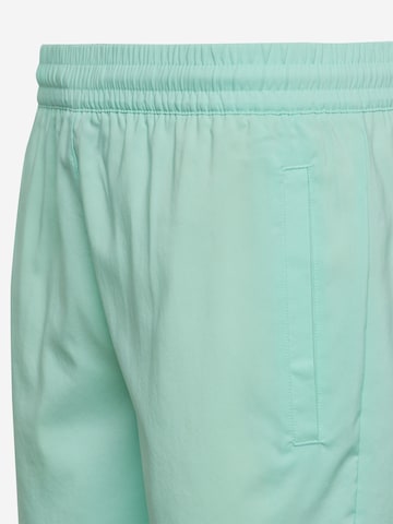 ADIDAS ORIGINALS Kratke kopalne hlače | zelena barva