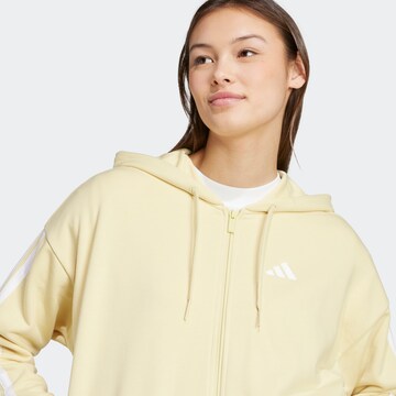 ADIDAS SPORTSWEAR Sports sweat jacket 'Essentials' in Yellow