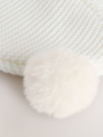 balta Next Megzta kepurė