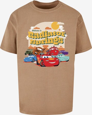 ABSOLUTE CULT T-Shirt 'Cars - Radiator Springs Group' in Beige: predná strana