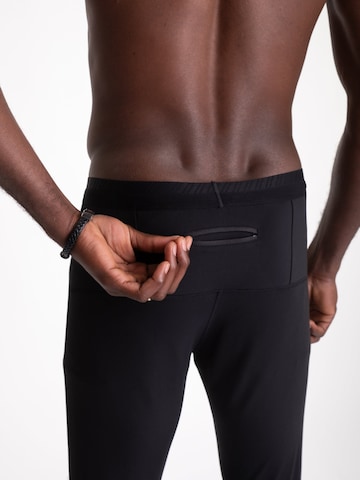 mymotus Tapered Sportbroek 'Mymotus Men Comfort Running Tight Black RM51 NOS' in Zwart