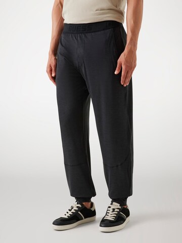 GUESS Tapered Pants in Black: front