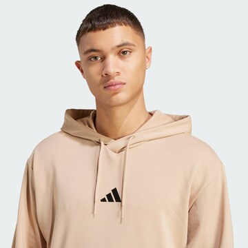 ADIDAS SPORTSWEAR Sports sweatshirt 'Essentials Feelcozy' in Brown
