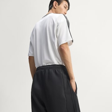 ADIDAS ORIGINALS - Loosefit Calças 'Teamgeist 26' em preto