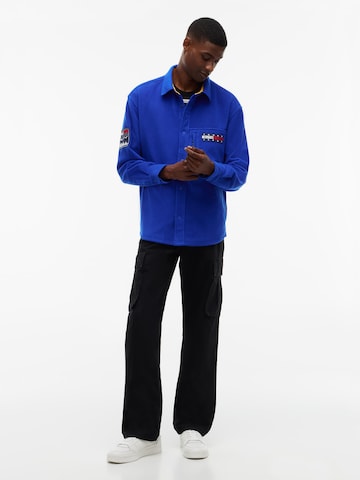mėlyna Tommy Jeans Patogus modelis Flisinis džemperis