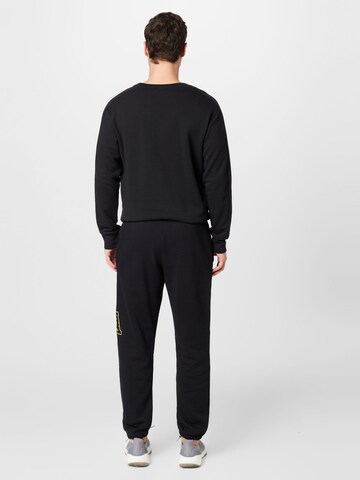 ADIDAS SPORTSWEAR Tapered Sportbroek 'All Szn X Logomania' in Zwart