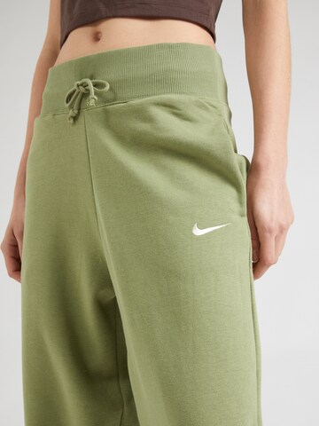 Nike Sportswear Alt kitsenev Püksid 'PHNX FLC', värv roheline