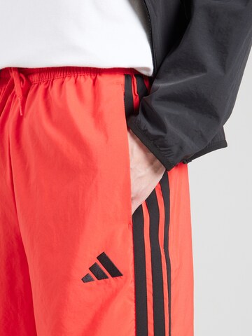 Regular Pantalon de sport 'Essentials Chelsea' ADIDAS SPORTSWEAR en rouge